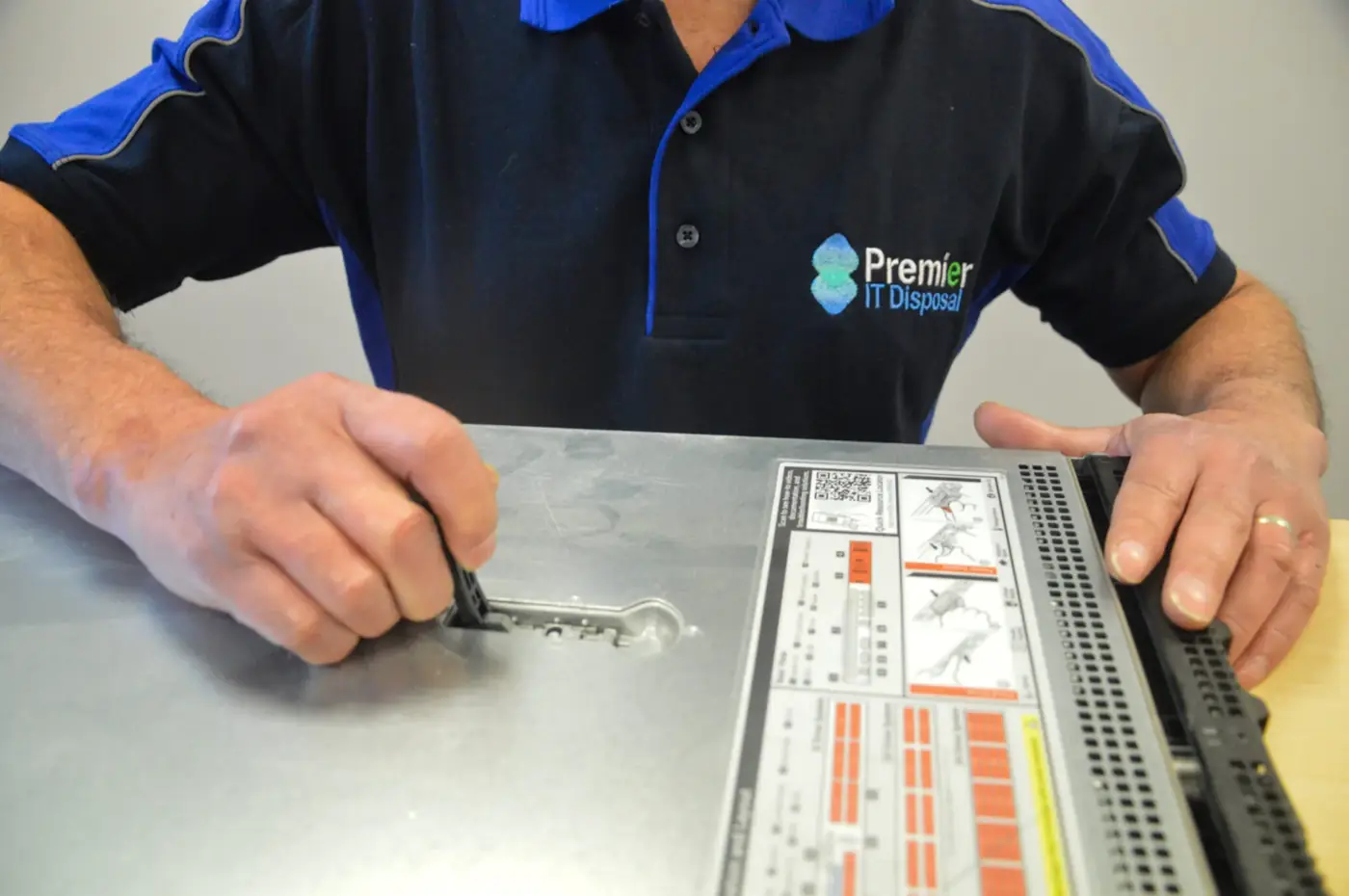 Premier IT Disposal technician scanning IT assets for tracking
